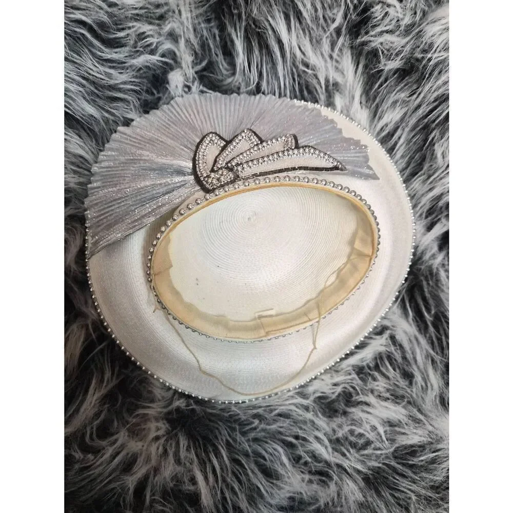 Silver pleated facinator hat